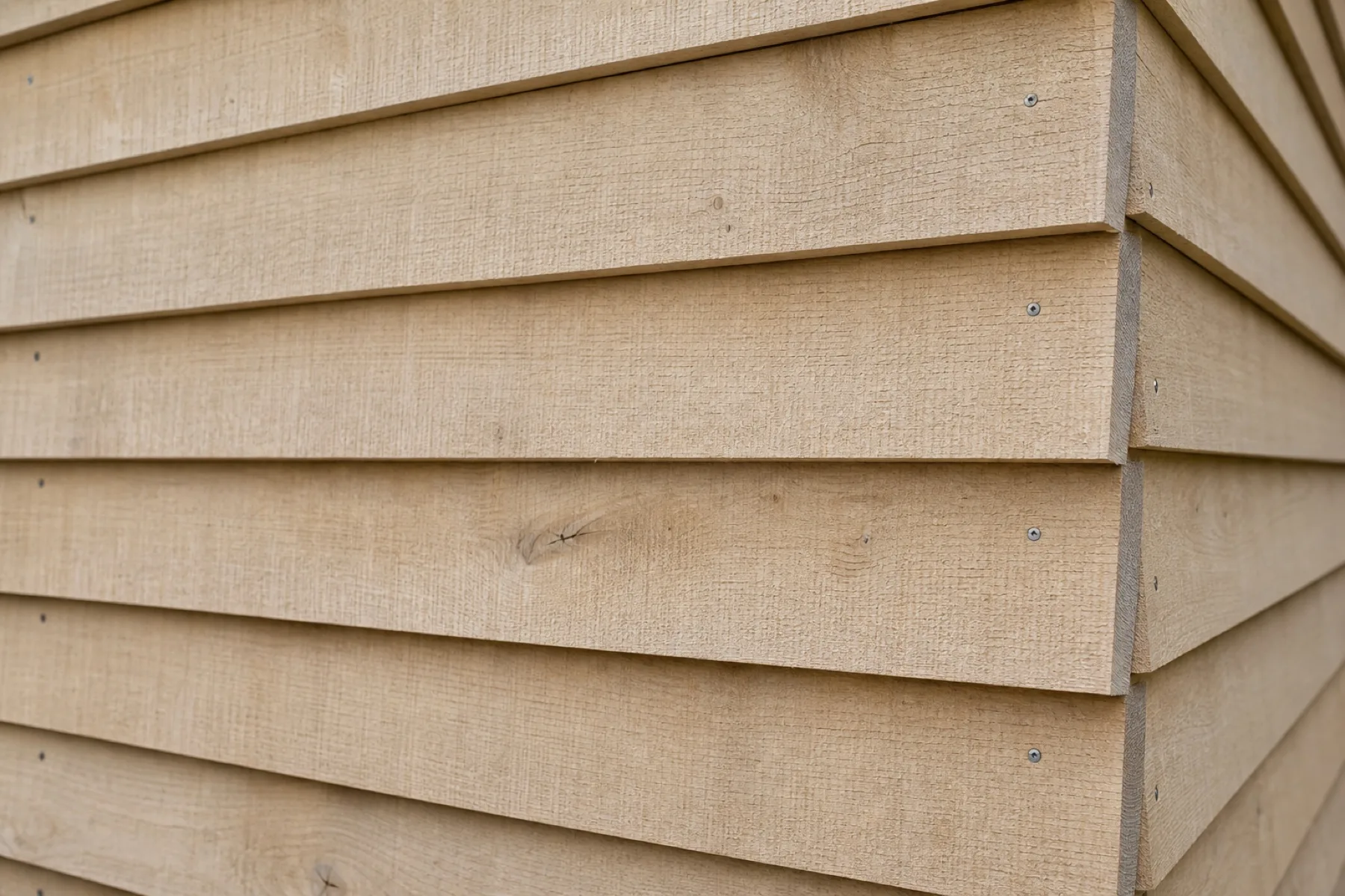 Feather edge oak cladding shot along the boards showing the taper